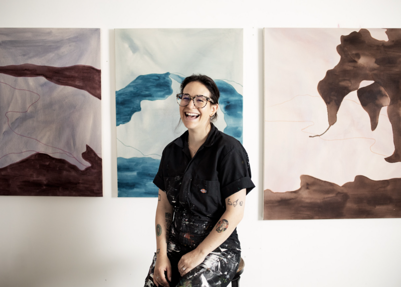 Artist Mel Reese in front of some works in progress